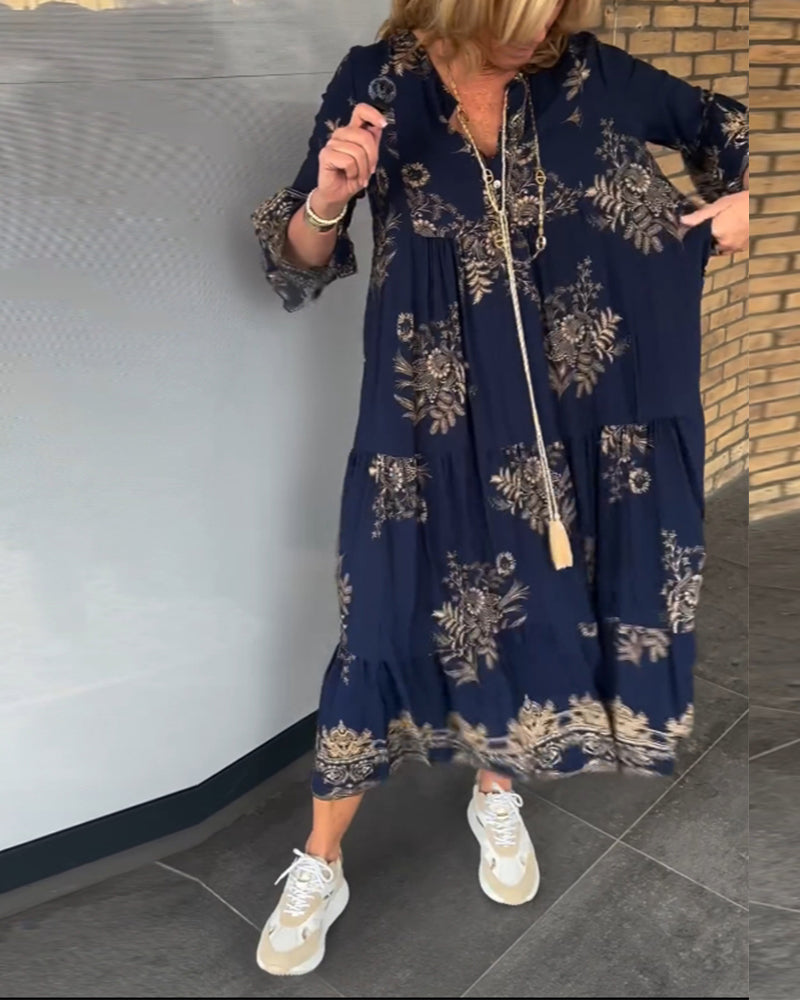 Damska sukienka midi z nadrukiem i dekoltem w kształcie litery V